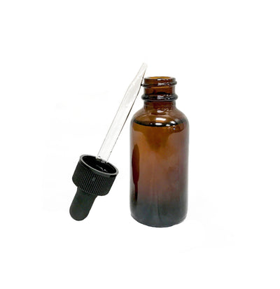 Lemongrass Oil in glass bottle with dropper out