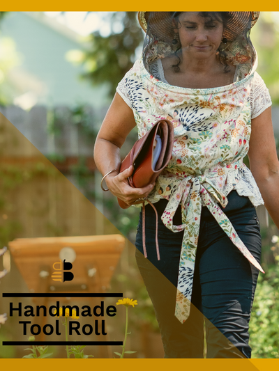 Female beekeeper carrying leather tool roll walking away from her beehive. Branding with Bee Built logo and text reading Handmade Tool Roll displayed in lower left hand corner. 