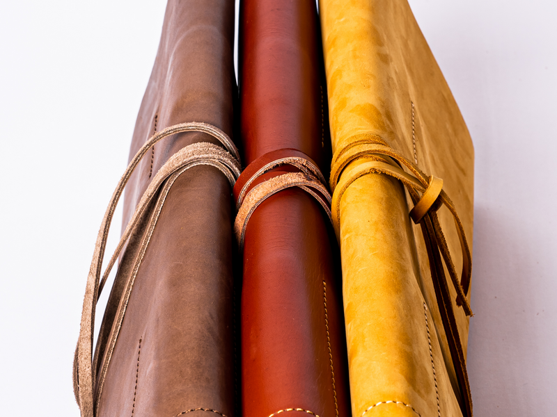 Leather tool rolls shown in 3 colors: brown, red, and gold.